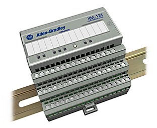 A grey measurement module mounted on a DIN rail 